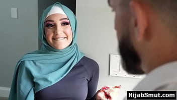 Youthfull muslim woman instructed by her soccer coach